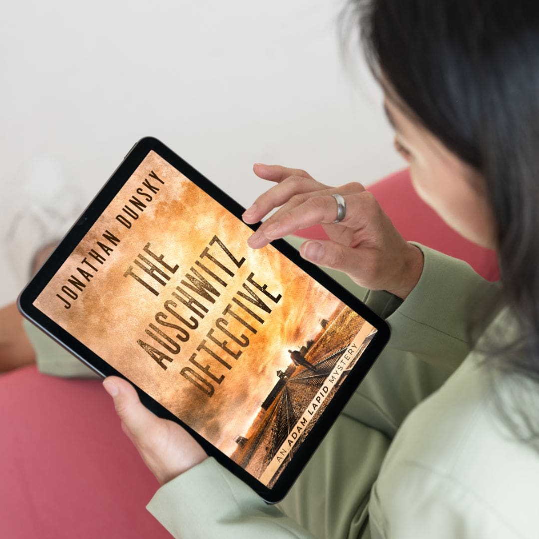 Woman reading The Auschwitz Detective on tablet